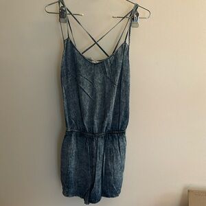 Cute little denim romper by Playsuit. Size 8 will for a small and medium.